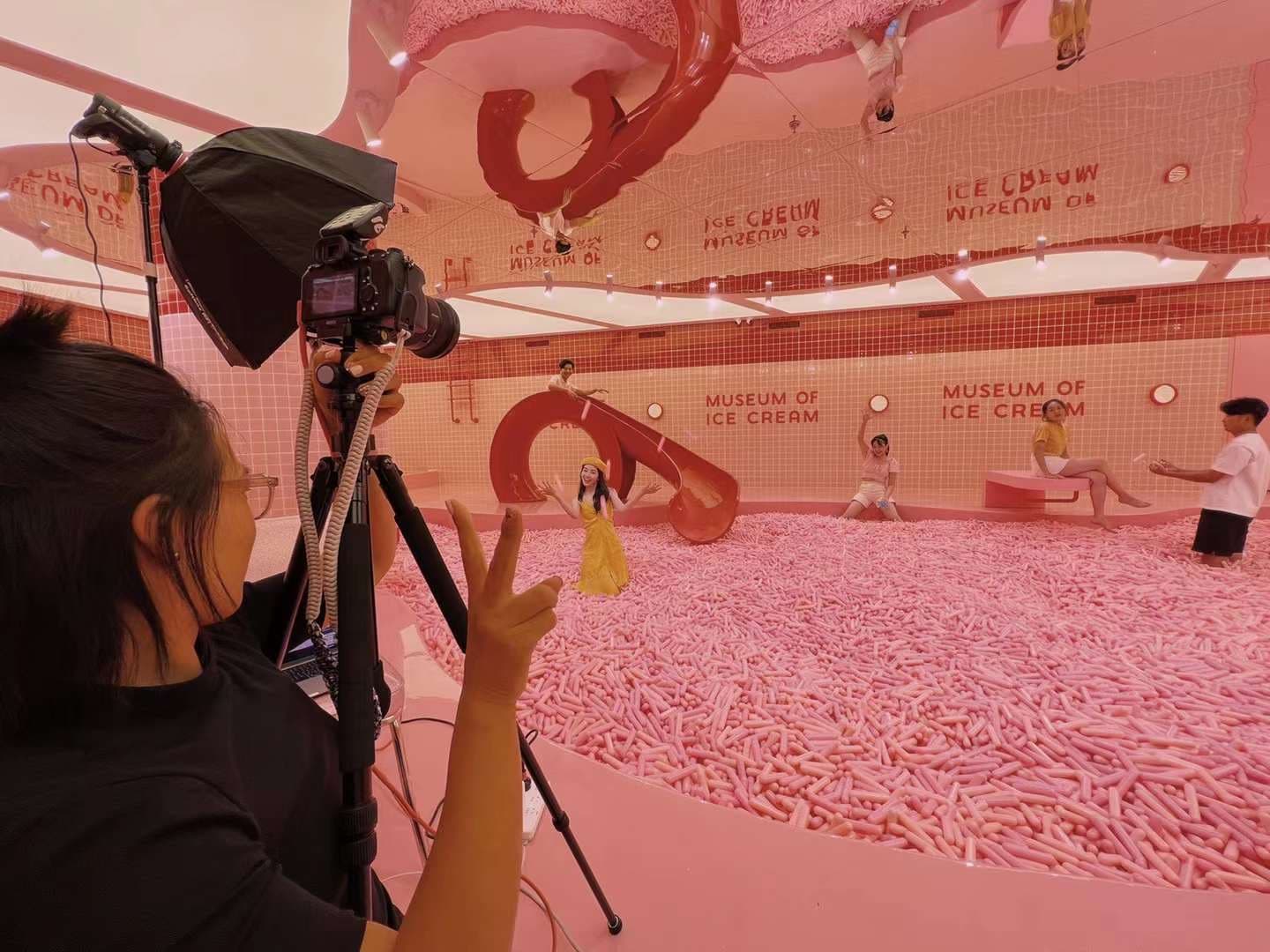 Behind the scenes of lifestyle brand shoot at Museum of Ice Cream with photographer directing models by Una Zhu