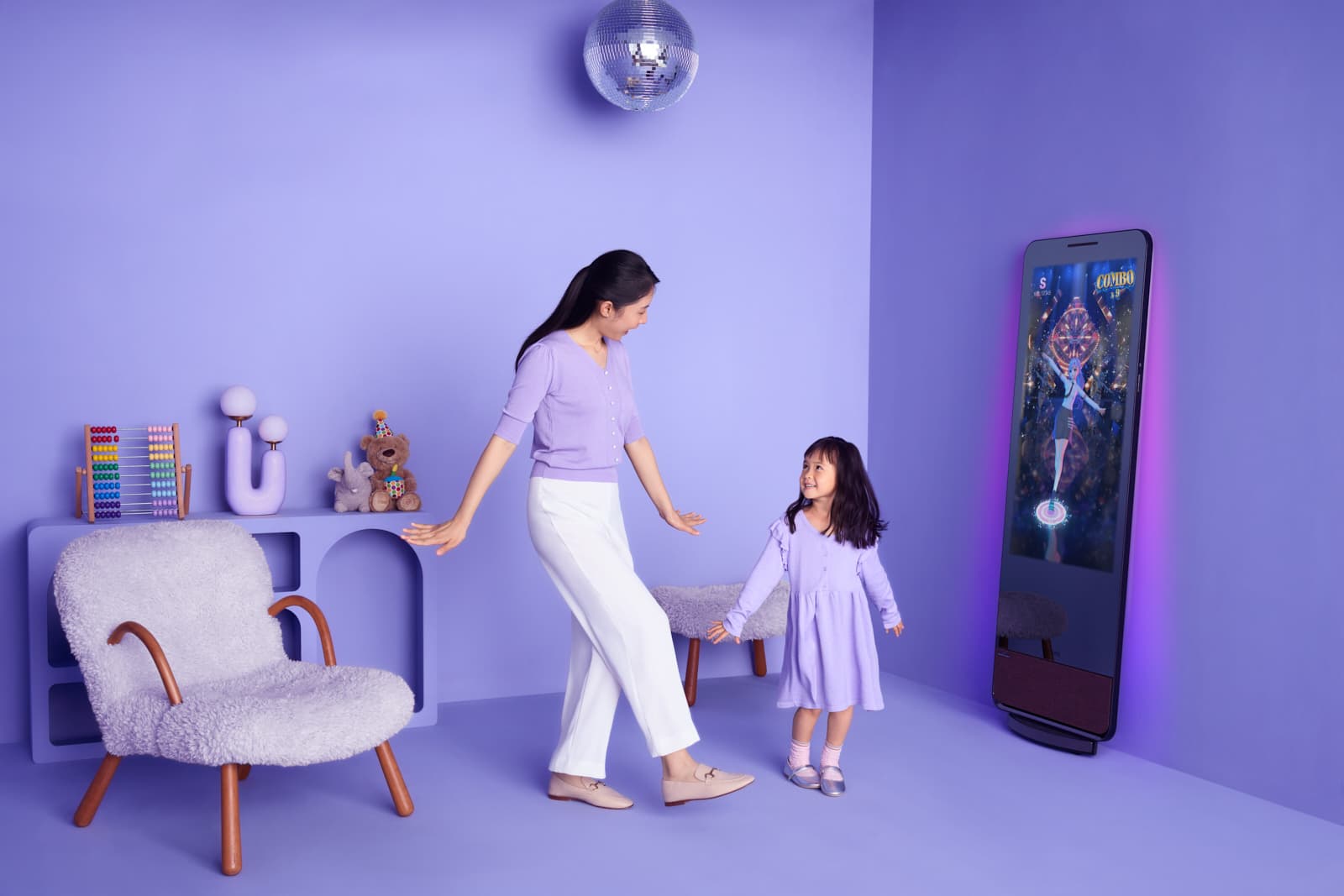 Lifestyle kids commercial campaign with mother and daughter dancing in styled lavender room by Una Zhu